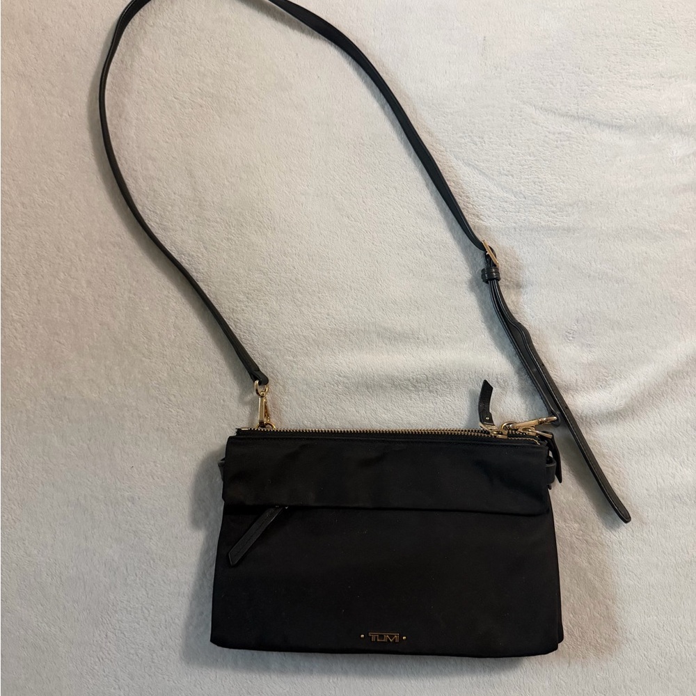 Tumi Black Crossbody with Gold Hardware | Three Compartments